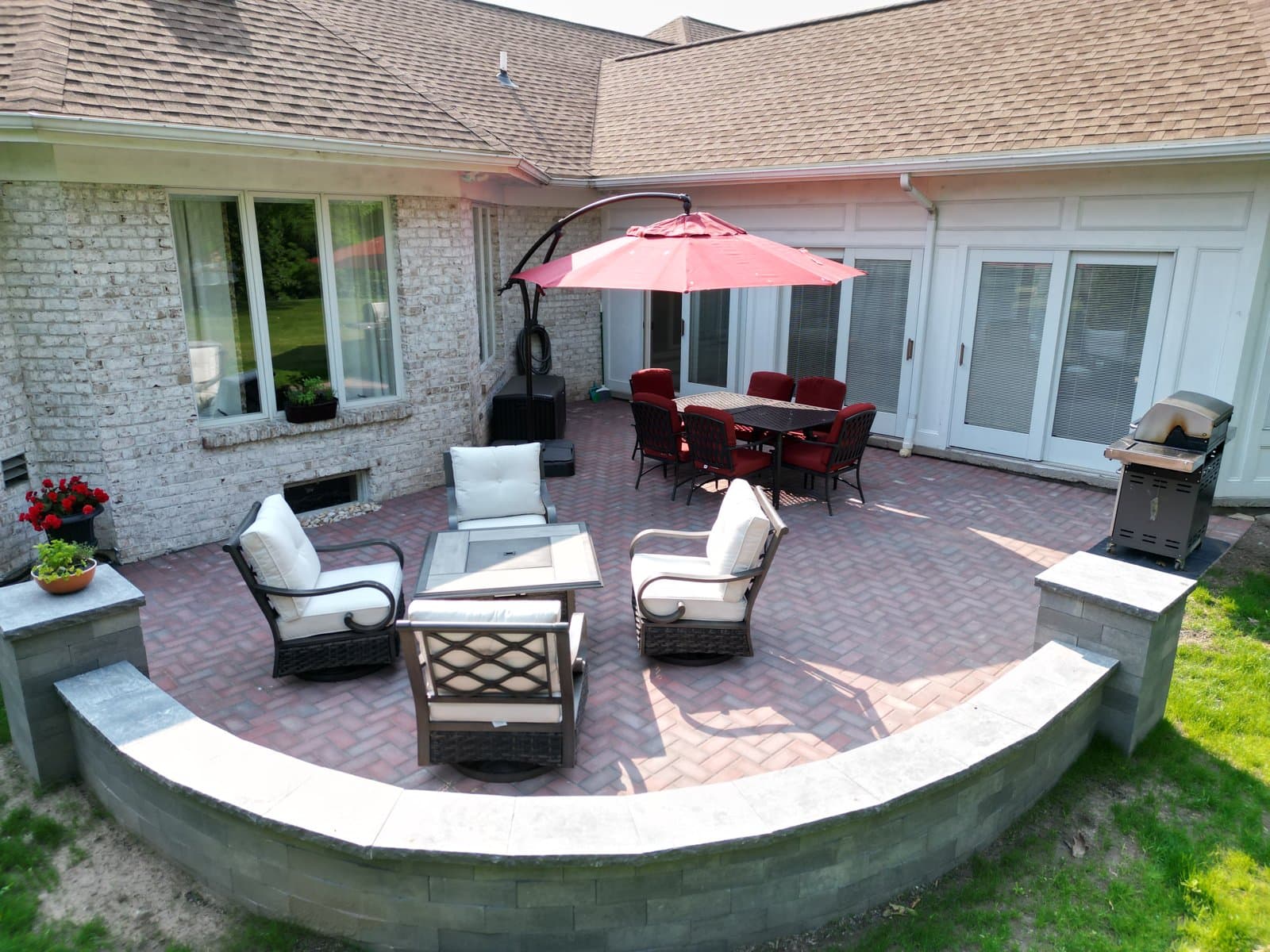 Brick paver patio with custom seating wall and pillars