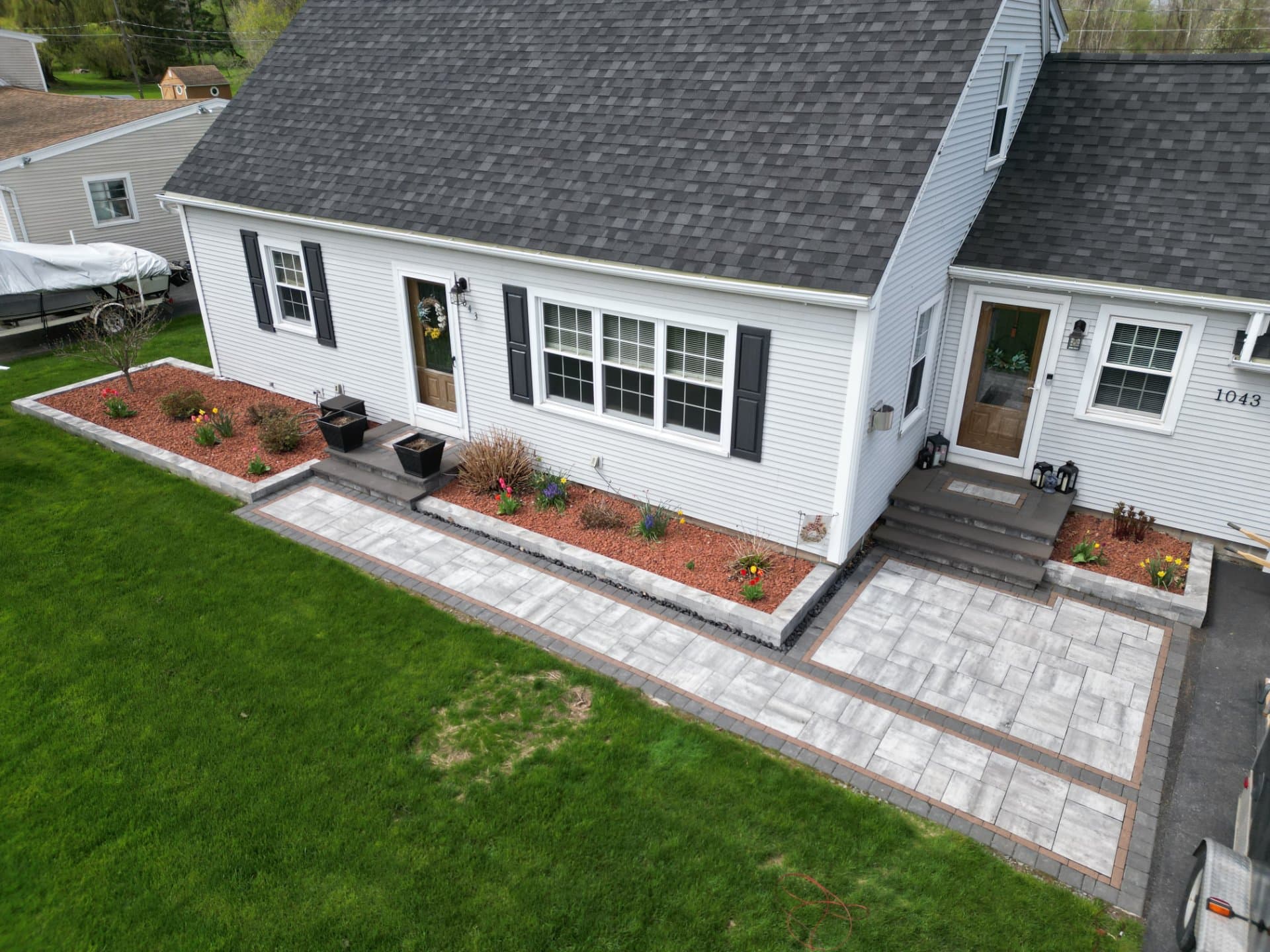 Paver entrance with landscape beds and new steps